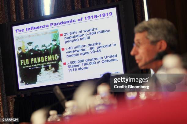 Monitor displays statistics of the flu outbreak of 1918-1919 showing the seriousness of a possible outbreak of an Avian Flu pandemic, with Anthony S....