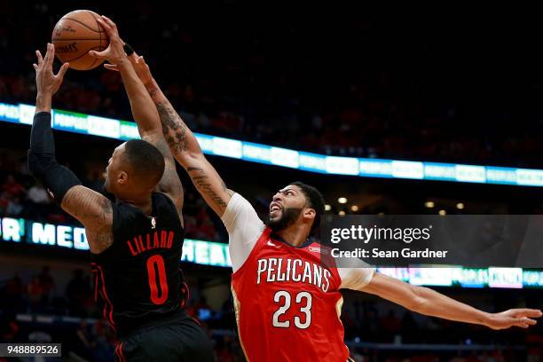Damian Lillard of the Portland Trail Blazers is fouled by Anthony Davis of the New Orleans Pelicans during Game 3 of the Western Conference playoffs...