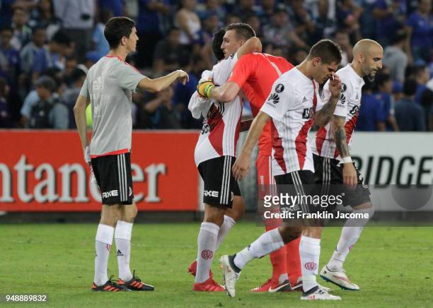 Franco Armani goalkeeper of River Plate celebrates with teammate Ignacio Scocco after winning the match between Emelec and River Plate as part of...