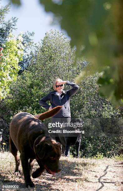 Nancy Seaver and her dogs Major and Bandy greet her husband Tom Seaver, former New York Mets Hall of Fame pitcher, as he prunes vines at their 3-acre...