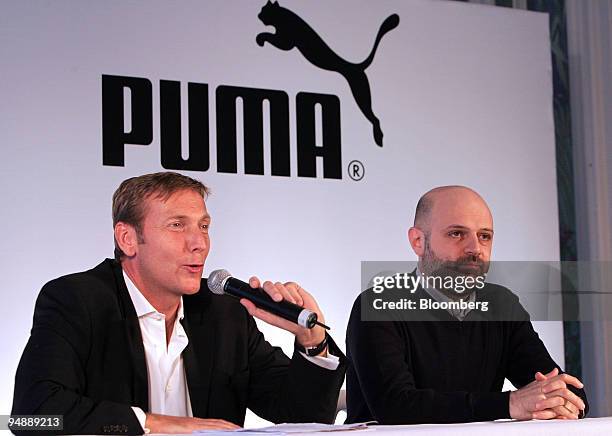 Jochen Zeitz, chief executive officer of Puma AG, left, speaks at a news conference with Hussein Chalayan, British-based Cypriot fashion designer, in...