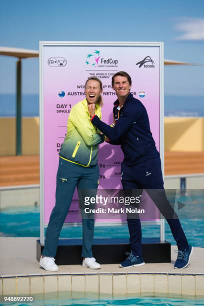 Australian captain Alicia Molik and Netherlands captain Paul Haarhuis pose for a photo during the official draw ahead of the World Group Play-Off Fed...