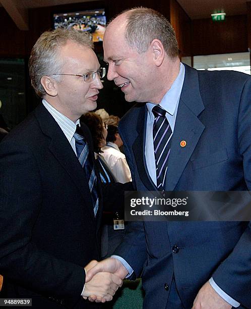 Per Nuder, left, the Swedish Minister for Finance greets Eero Heinaeluoma, the Minister of Finance for Finland before the start of the EcoFin meeting...