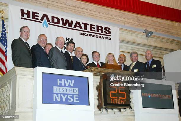 New York Stock Exchange CEO John Thain and President and Co-COO Katherine Kinney celebrate the opening bell ceremony with representatives from...