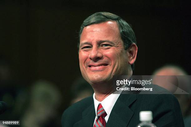 Judge John Roberts enjoys a lighter moment during the Senate Judiciary Committee hearing in Washington, DC on September 13, 2005 on his nomination to...