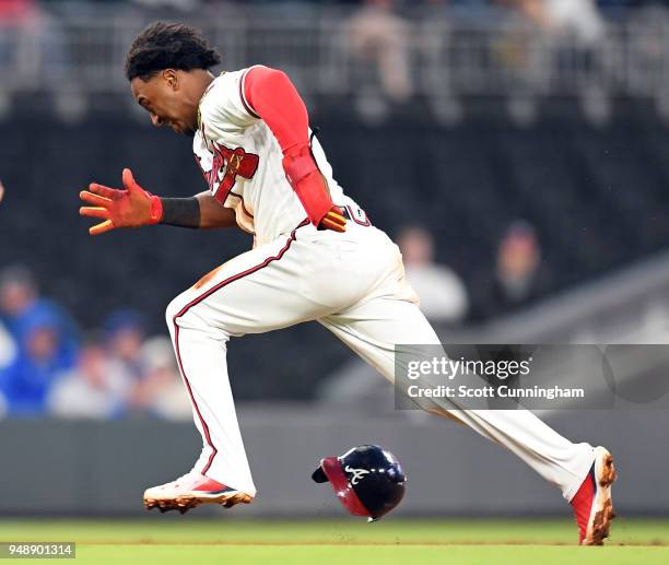 Ozzie Albies of the Atlanta Braves advances to third base in the first inning against the New York Mets at SunTrust Park on April 19, 2018 in...
