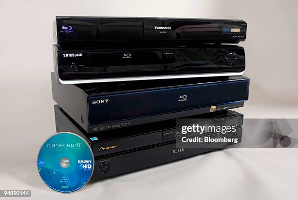 Blu-ray disc players, from top, a Panasonic DMP-BD30, Samsung BD-P1400, Sony BDP-S500, and Pioneer Elite BDP-95FD are stacked next to a Blu-ray disc...