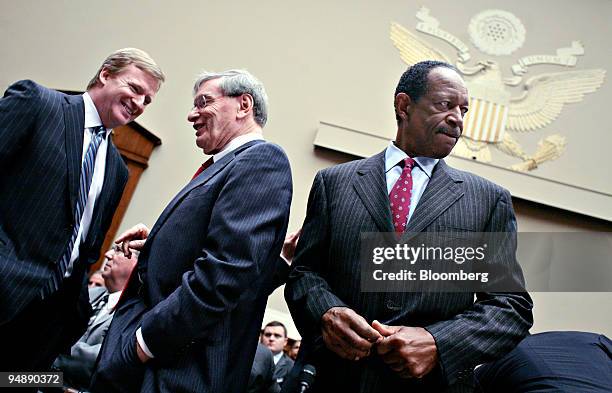 Roger Goodell, commissioner of the National Football League , left, talks with Allan 'Bud' Selig, commissioner of Major League Baseball , center, as...