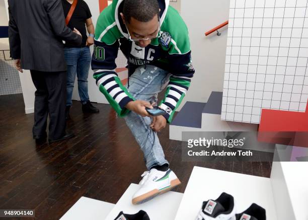 Guest admires sneakers on display at the Launch of the FILA Mindblower Pop-Up Powered by Ciroc on April 19, 2018 in New York City.