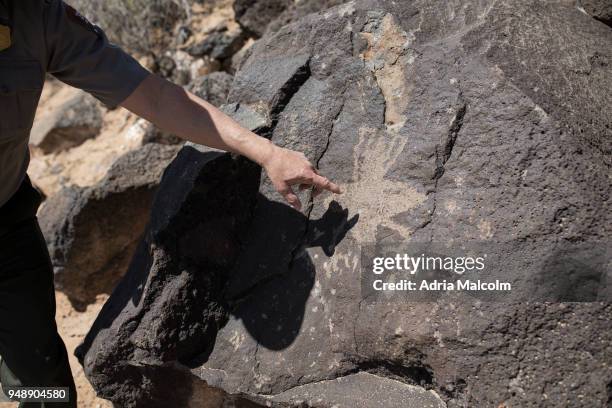 Park Ranger Superintendent Dennis A. Vasquez guides a tour pointing out petroglyphs at Petroglyph National Monument on April 19, 2018 in Albuquerque,...