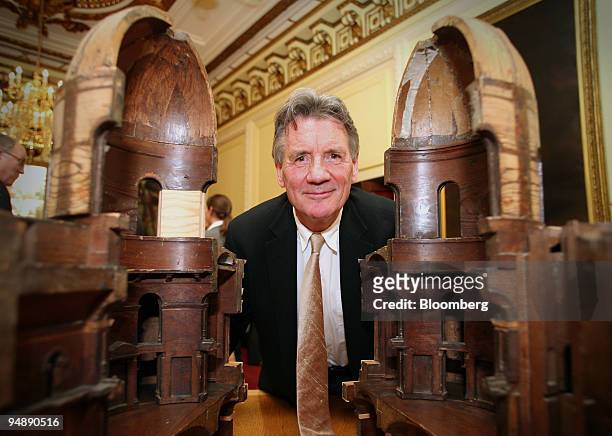 Michael Palin poses next to the original maquette for Nicholas Hawksmoor's designs for the Radcliffe Camera at the British Academy in central London,...