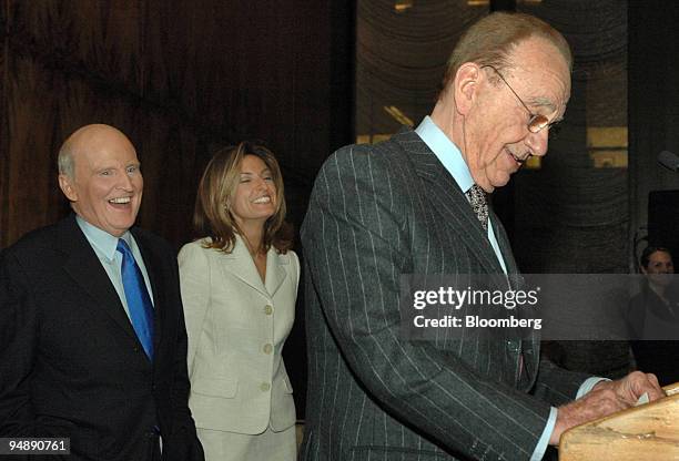 Jack Welch, left, former chief executive of General Electric Co. And author of the book "Winning," laughs with his wife Suzy at a joke made by News...