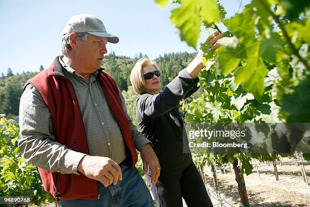 Tom Seaver, former New York Mets Hall of Fame pitcher, and his wife Nancy prune vines while checking for signs of new fruit growth at their 3-acre...