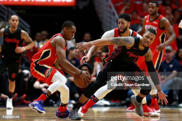 Damian Lillard of the Portland Trail Blazers is fouled by Rajon Rondo of the New Orleans Pelicans during Game 3 of the Western Conference playoffs...