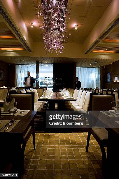 Tables are set at Sattvik restaurant at Select CityWalk Mall in New Delhi, India, on Saturday, Sept. 6, 2008. New Delhi today has more options for...