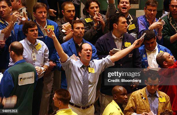 Traders work in the crude oil pit at the New York Mercantile Exchange on Monday, February 9, 2004. Crude oil rose as ministers from the Organization...