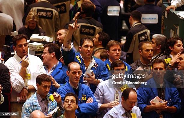 Traders work in the crude oil pit at the New York Mercantile Exchange on Monday, February 9, 2004. Crude oil rose as ministers from the Organization...