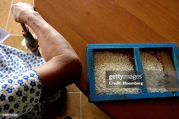 Rice samples are taken after milling and polishing at a rice mill in Nueva Ecija, the Philippines, on Friday, May 23, 2008. The world is wasting...