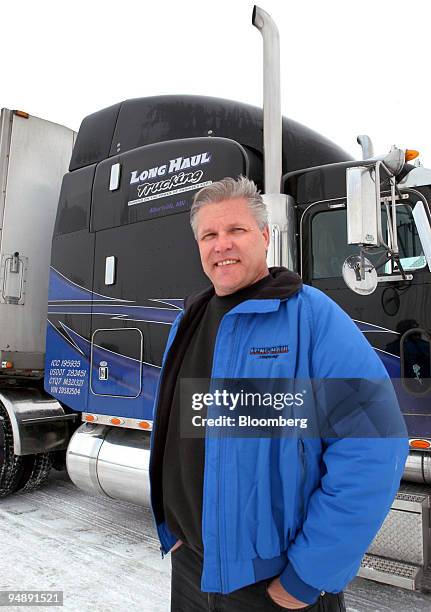 Long Haul Trucking Inc. Owner John Daniels stands next to one of his new Peterbilt heavy-duty trucks in Albertville, Minnesota on Monday, February 9,...