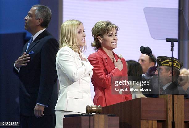 Olympic gold medal winning gymnasts Kerri Strug, center, and Mary Lou Retton say the Pledge of Allegiance at the Republican National Convention in...