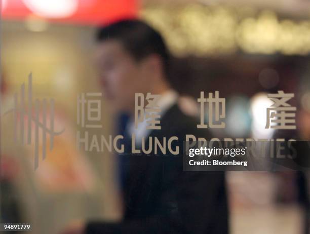 Man walks inside Grand Gateway Mall, developed by Hang Lung Properties Ltd., in Shanghai, China, on Wednesday, Feb. 20, 2008. Hang Lung Properties...