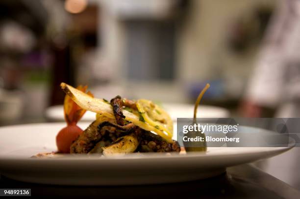 Serving of grilled octopus "Mykonos" with feta cheese, capers, and cured lemon is arranged for a photo at Fraiche restaurant located at 75 Hillside...