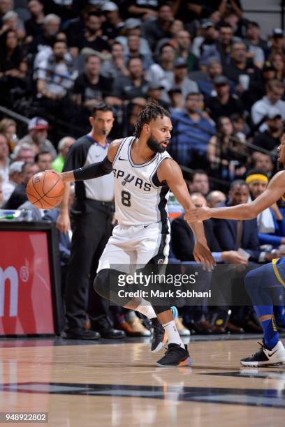 Patty Mills of the San Antonio Spurs handles the ball against the Golden State Warriors during Game Three of the Western Conference Quarterfinals in...