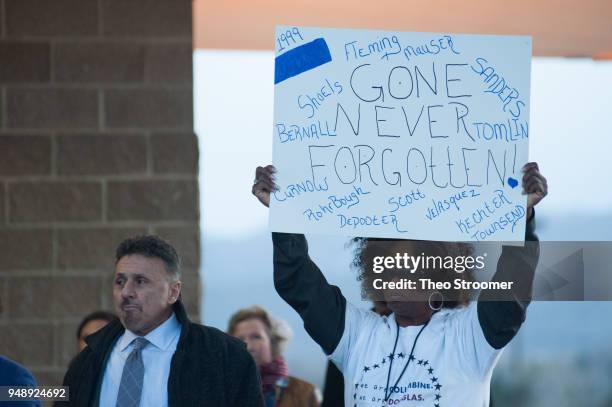 An attendee holds a sign during the Vote For Our Lives rally and vigil at Columbine High School on April 19, 2018 in Littleton, Colorado. April 20...