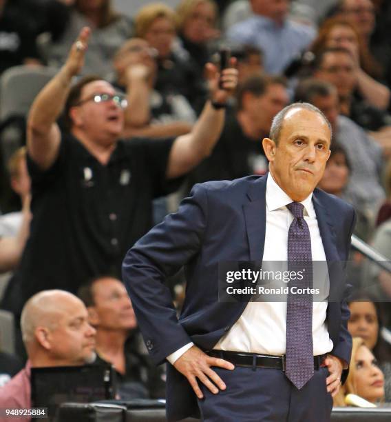 Ettore Messina looks on as a fan protest a foul not called against the Golden State Warriors at AT&T Center on April 19 , 2018 in San Antonio, Texas....