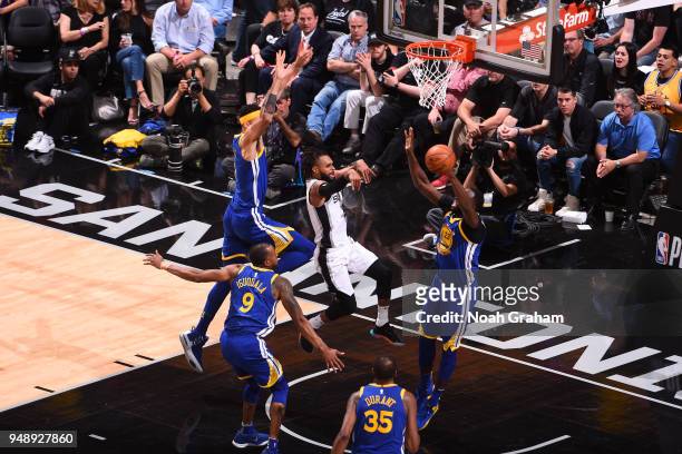 Patty Mills of the San Antonio Spurs passes the ball against the Golden State Warriors in Game Three of Round One of the 2018 NBA Playoffs on April...