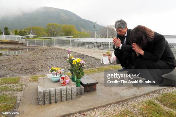 Parents of Shihomi Waki visit the site where their daughter lost her life on April 15, 2018 in Minamiaso, Kumamoto, Japan. The first of the two big...