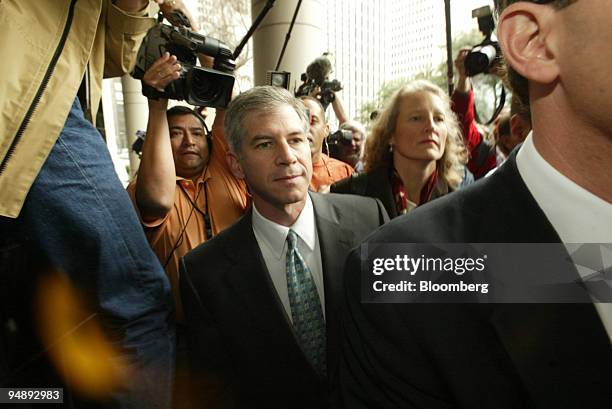 Former Enron Chief Financial Officer Andrew Fastow arrives at the Federal Courthouse in Houston January 14, 2004 with his attorneys to enter his plea...