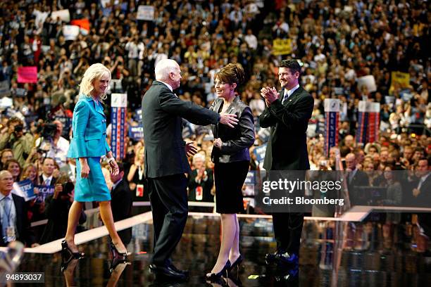 Senator John McCain of Arizona, Republican presidential candidate, second from the left, and his wife Cindy, left, greet Sarah Palin, governor of...