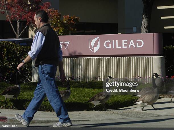 Man walks past Gilead Sciences Inc. Offices in Foster City, California on Monday, October 31, 2005. The firm developed Tamiflu, an antiviral drug...