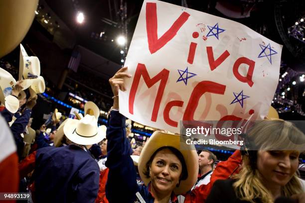 Delegate from Texas holds a sign reading "Viva McCain" on day four of the Republican National Convention at the Xcel Energy Center in St. Paul,...