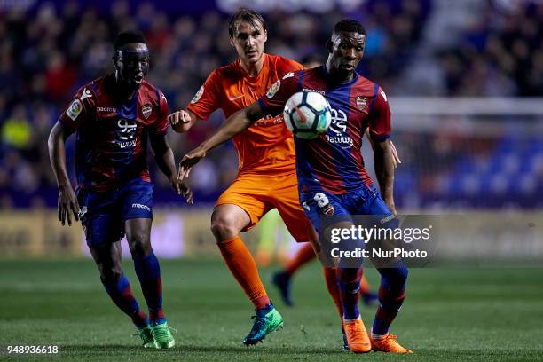 Ignasi Miguel Pons of Malaga CF competes for the ball with Boateng and Lerma of Levante UD during the La Liga game between Levante UD and Malaga CF...