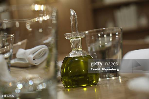 Olive oil sits on a table at Mia Dona in New York, U.S., on Monday, Feb. 25, 2008. The new restaurant is on 58th Street at 3rd Avenue and is the...