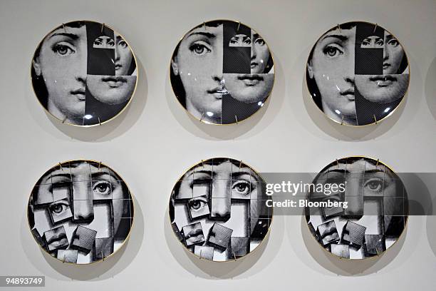 Plates hang on the wall at Mia Dona in New York, U.S., on Monday, Feb. 25, 2008. The new restaurant is on 58th Street at 3rd Avenue and is the latest...