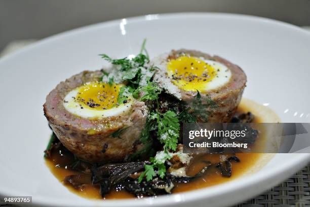 Plate of Florentine Meatloaf is displayed for a photograph at Mia Dona in New York, U.S., on Monday, Feb. 25, 2008. The new restaurant is on 58th...