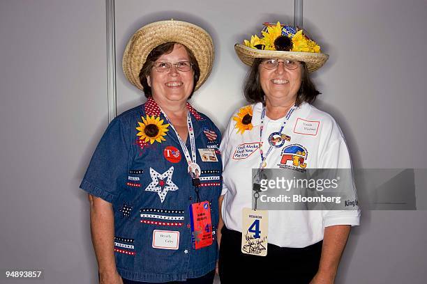 Beverley Caley, left, and Vonda Wiedmer, delegates from Kansas, stand for a photo on day four of the Republican National Convention at the Xcel...