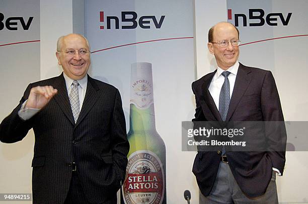 Pierre Jean Everaert, left, chairman of InBev and John Brock, chief executive arrive for a press conference in Leuven, Belgium, Thursday, September...