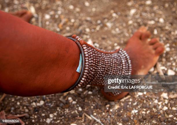 Himba woman with beaded anklets to protect their legs from venomous animal bites, epupa, Namibia on March 3, 2014 in Epupa, Namibia.