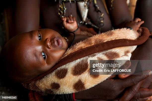 Himba baby, epupa, Namibia on March 3, 2014 in Epupa, Namibia.