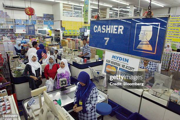 Sign designating a check-out counter for males is displayed at a supermarket in Kota Bharu, Kelantan, Malaysia, on Friday, Feb. 22, 2008. In the...