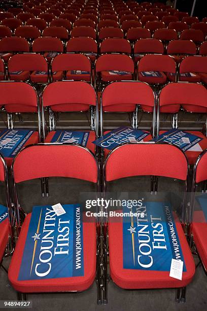 Signs reading "Country First," the campaign slogan for Senator John McCain of Arizona, Republican presidential candidate, sit on seats on day three...