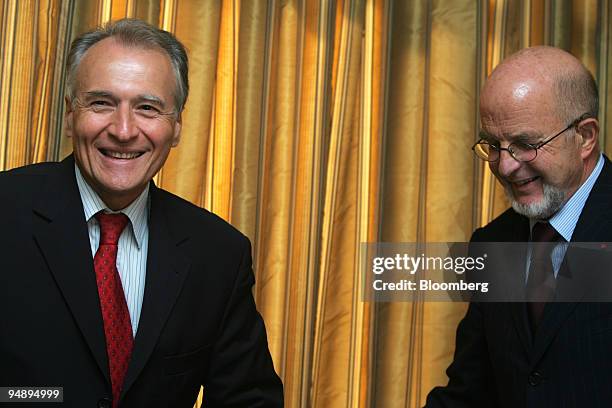 Xavier Huillard , general director and future chief executive of Vinci, jokes with Antoine Zacharias , chairman, after the company's 2005 mid-year...