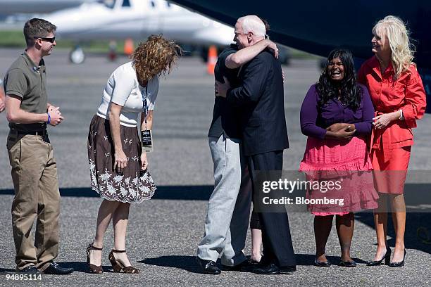 Senator John McCain of Arizona, Republican presidential candidate, third from the right, greets members of his family as his wife Cindy, right, and...