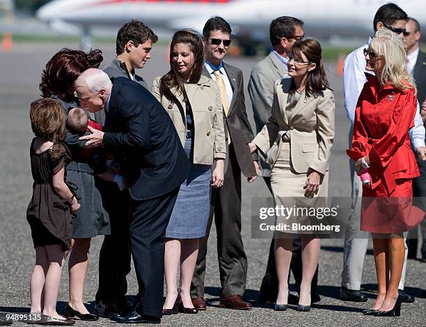 Senator John McCain of Arizona, Republican presidential candidate, third from the left, kisses the baby of Sarah Palin, governor of Alaska and...