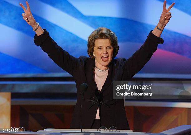 Senator Dianne Feinstein raises victory "V's" after officially nominating Senator John F. Kerry for the U.S. Presidency during the third session of...