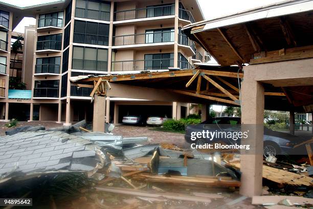 Debris litter the ground outside a building in Marco Island, Florida, Monday, October 24, 2005. Hurricane Wilma headed into the Atlantic Ocean after...